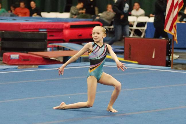 Westys hosts gymnastics invitational Westys gymnast Chelsea Smith is all smiles during a floor routine.