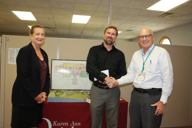 Lowes of Newton donates to hospice plans Cecelia Clayton of the hospice, Jim Cummings of Lowes and Glenn Lewis of the hospice