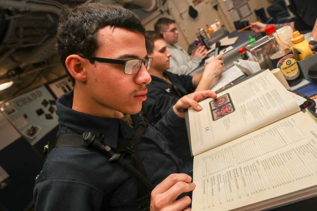 Local sailor in Arabian Sea ARABIAN SEA (July 1, 2019) Electrician's Mate Fireman Apprentice Darien Johnston, from Netcong, N.J., plays Dungeons & Dragons during an event hosted by Morale, Welfare and Recreation (MWR) in the mess decks aboard the Nimitz-class aircraft carrier USS Abraham Lincoln (CVN 72). (U.S. Navy photo by Mass Communication Specialist 3rd Class Darcy McAtee/Released)