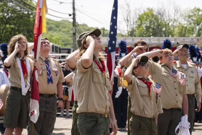 BP1 Members of Boy Scout Troop 276 salute the flag at the firehouse in Byram. . (Photo by John Hester)