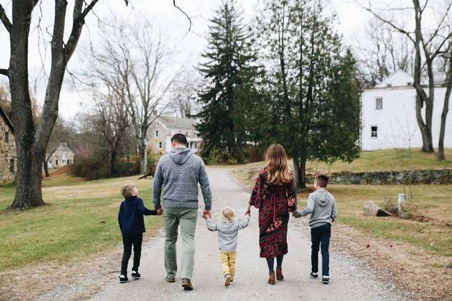 The 'essential' life of Reilly Reilly's main impetus for exploring essential oils was to better her health and that of her family. Here she is strolling with her husband and their three sons.