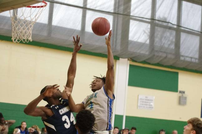Camden downs Sussex in men's hoops Sussex County's Michael Cooper takes the ball towards the hoop in the first period. Cooper scored two points and is credited with two steals.
