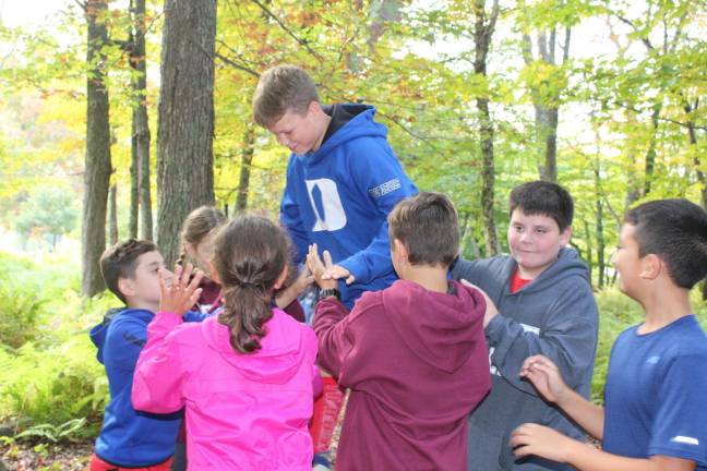Byram Township Intermediate School students learn team building on the ropes course during a class trip to Frost Valley YMCA Camp.