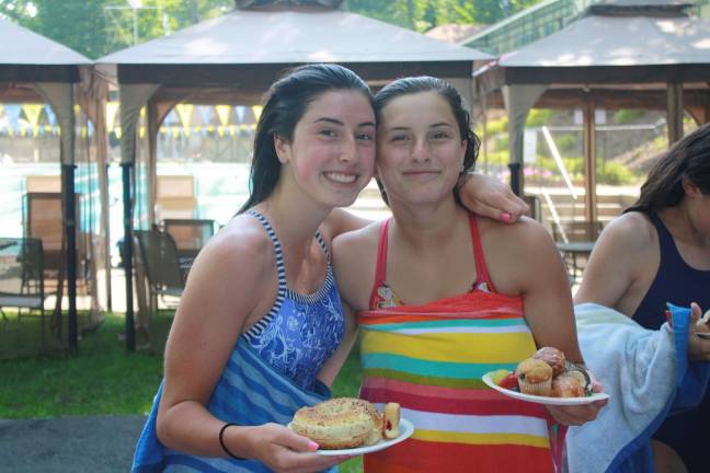 Swim-a-thon to benefit youth group Valerie & Sam Russo fuel up after swimming several laps.