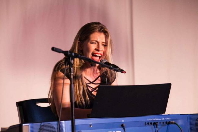 Queen of the Fair gives back to county Throws benefit concert this Friday Wask at the piano belting out a song