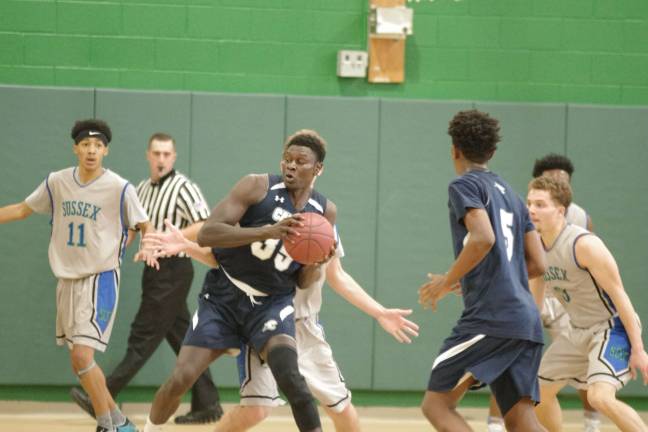 Camden downs Sussex in men's hoops Camden's Sanoussi Abdourhamane handles the ball under tight coverage.