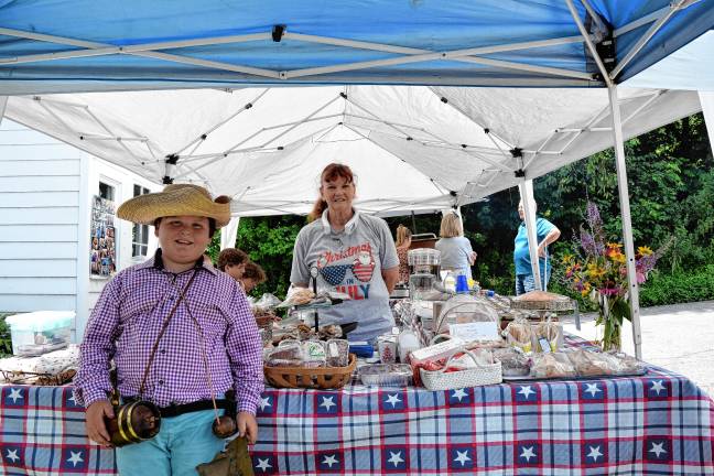A trip back in time <b>Heath Ziccardi, 10, poses with Janet Woudenberg, who is selling lunch and homemade treats.</b>