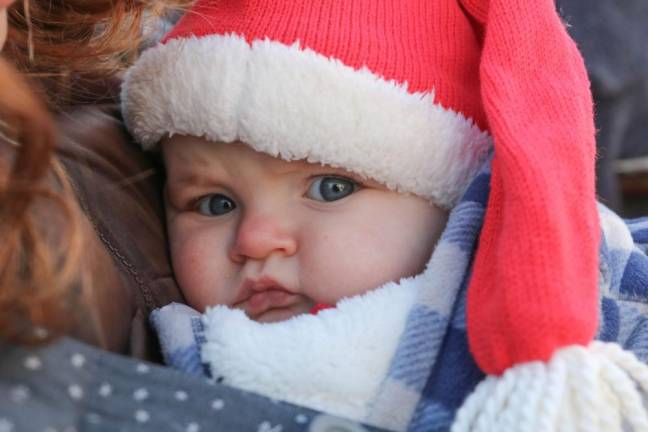 Emilia Lyden, 6 months, stays warm in her Santa hat.