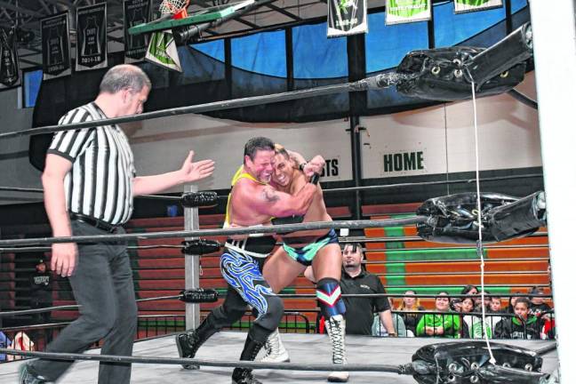 Michael Mars, in suspenders, wrestles LSG in an Independent Superstars of Pro Wrestling (ISPW) match Friday, April 12 at Hopatcong High School. The event raised funds for the Class of 2024. (Photos by Maria Kovic)