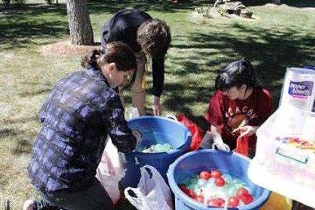 Pokemon water balloon fight on SCCC campus Students gather water balloons to participate in the Pokemon Go Water Balloon Fight.