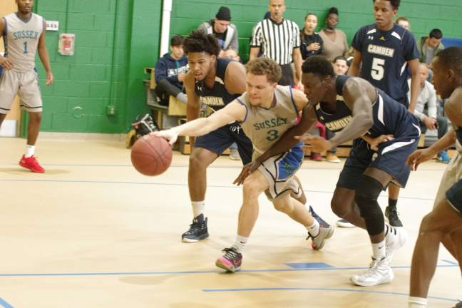 Camden downs Sussex in men's hoops Sussex County's Rios gets a hand on the loose ball in the first period.