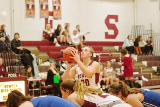 Newton's Amy Fehr aims the ball from the foul line in the second quarter. Fehr scored 16 points grabbed 15 rebounds, made 2 assists, blocked 3 shots and is credited with 3 steals.