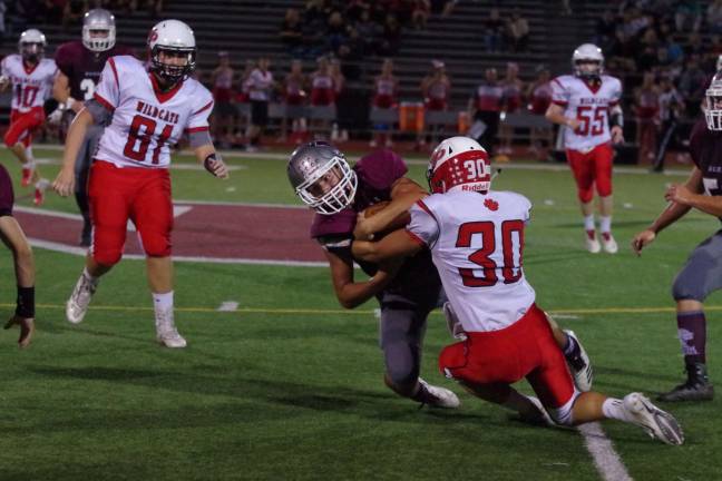 Newton Braves keep rolling Peyton Nolan holds onto the ball as he is taken down by Whippany Park linebacker Michael Roma (30) in the first quarter. Roma accomplished nine tackles.