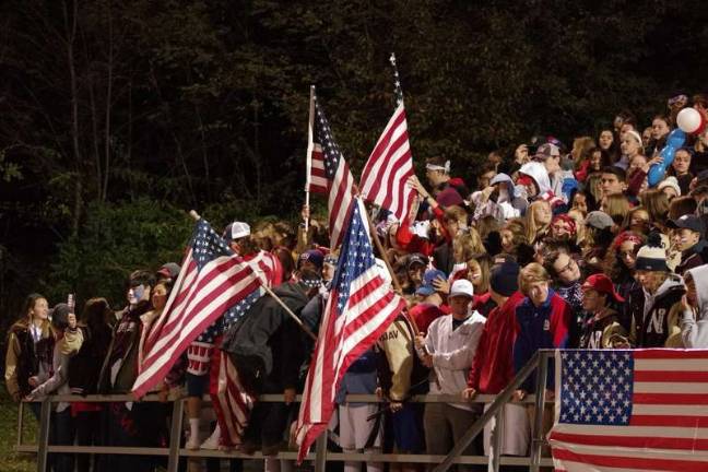 Braves defeat Kittatinny 28-17 American flags are waved among Newton Braves football fans in the stands. (Photos by George Hunter).