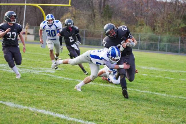 KRHS defeats Wallkill in football Kittatinny defender Calvin Brook tackles Wallkill Valley ball carriere Dylan Harlos. Harlos scored one rushing touchdown.