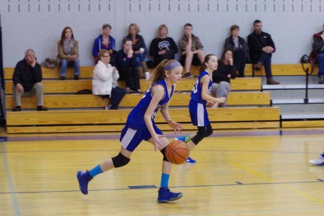 Kittatinny's Tiffani Skzarlatiuk brings the ball upcourt.