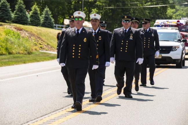 BP2 Members of the Byram Township Fire Department march in the parade.