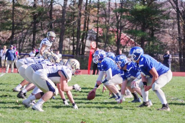 The Morris Catholic defensive line face the Kittatinny offensive line in the first half.