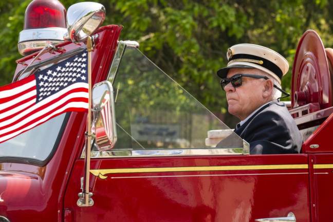 An antique Cranberry Lake firetruck is driven in the parade.