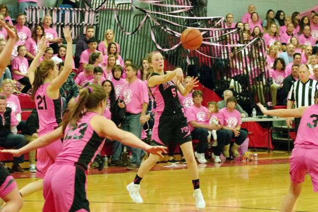 High Point prettier in pink than Newton High Point's Trisha Peterson tosses the ball. Peterson contributed eight points, four rebounds, and six assists.