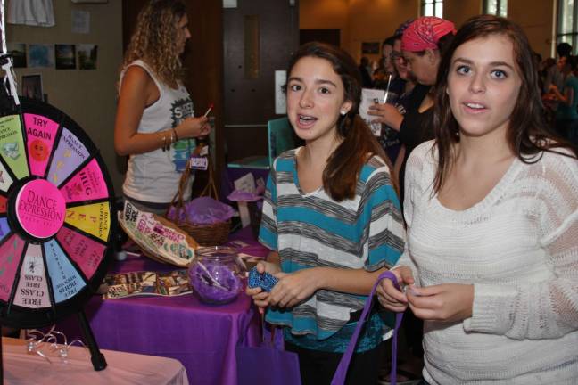 Girls, girls and more girls Lauren Danko and friend Brittany Galvin of Sparta spin the wheel at Dance Expression.