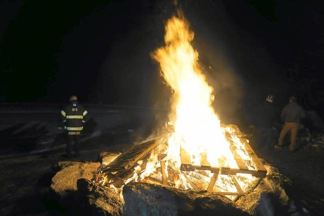 The bonfire’s flames were welcome on a cold night (Photo by Vera Olinski)