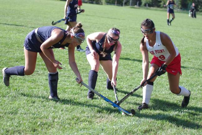 High Point tops LVRHS in field hockey opener Lenape Valley Patriots and a High Point Wildcat use their sticks to reach for the ball.