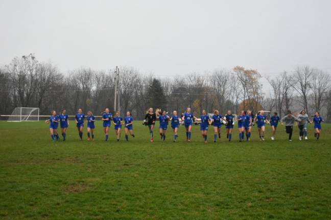 The Kittatinny Cougars walk off the field after winning the title.