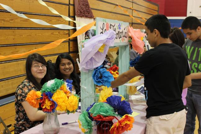 Polyglot paradise at Lenape Valley Photos by Stacy Maldonado Delfina Hernandez and partner Sophia Meah selling flowers.