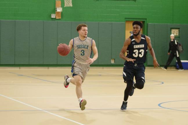 Camden downs Sussex in men's hoops Sussex County's Rios handles the ball as Camden's Emmanuel Abimbola keeps pace.