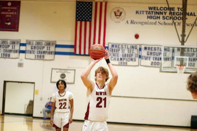 Newton's Nick Kurilko prepares a shot from the free throw line. He grabbed seven rebounds and made two steals.