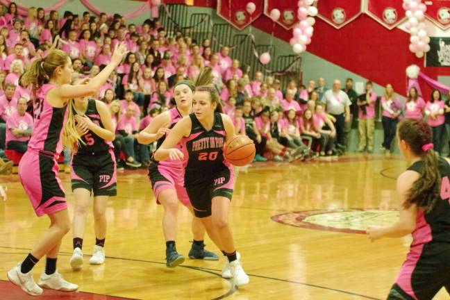 High Point prettier in pink than Newton High Point's Margo Peterson moves the ball on the court.