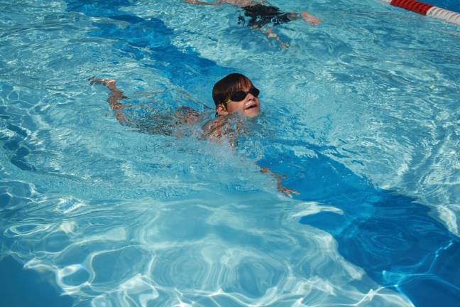 Swim-a-thon to benefit youth group Photos by Rose Sgarlato Leo Biondo, age 5, goes for fifteen laps at Lake Mohawk Pool’s swim-a-thon.