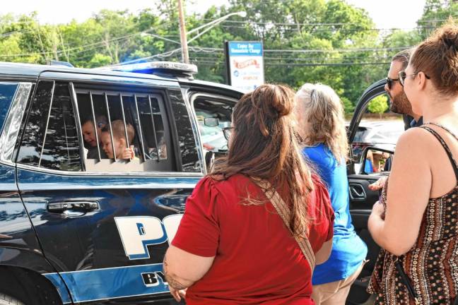 Cones with a Cop in Byram CC2 Two little boys check out the inside of a police car.