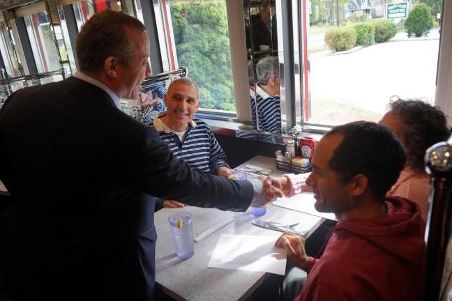 Congressman Josh Gottheimer greets “Cup of Joe with Josh” Town Hall attendees in Andover.