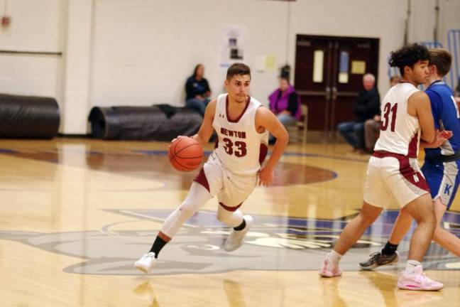 Newton's Jack Hunterton is on the move with the ball. He scored eight points and grabbed six rebounds.