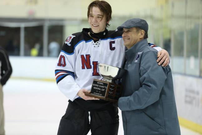 Justin Zappe, N/LV captain, accepts the Charette Cup.