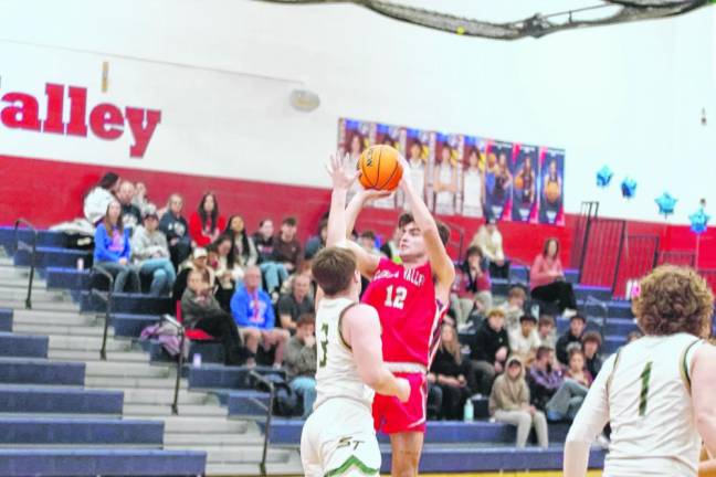 Lenape Valley's Anthony Kali shoots under tight coverage. He scored two points.