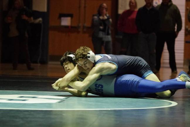 Sparta's Ryan Hrenenko, top, grapples with Kittatinny's Dylan Zupkay in the 126-pound weight class. Hrenenko pinned Zupkay in 2:40 on Jan. 26.