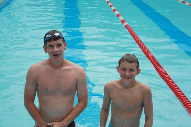Swim-a-thon to benefit youth group Eric Vincelette, age 14 and WIll Englehardt, age 13 swim over 100 laps each.