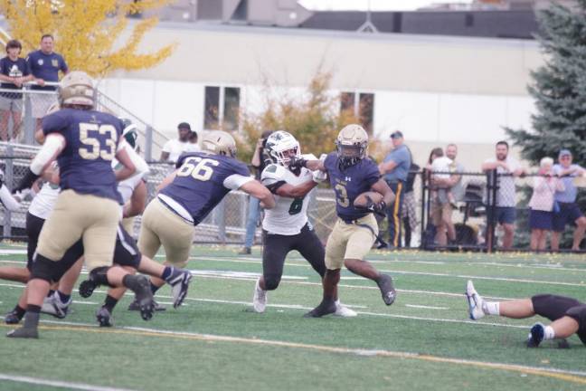 Newton, Sparta, Sussex Tech advance to semis in playoffs Pope John ball carrier Tylik Hill stiff-arms a St. Joseph of Metuchen defender Saturday, Oct. 28 in Sparta. The Lions lost the game, 10-6. (Photos by George Leroy Hunter)