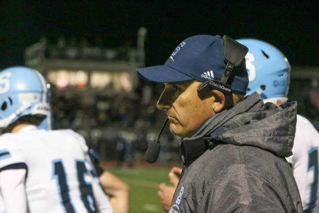 Sparta football clinches sixth victory Head Coach Marchiano keeps a watchful eye on play.