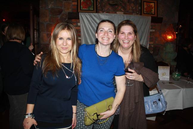 The Nerds rock out to aid Hilltop Country Day School scholarships Hilltop parents Bozena Diaz, Sara Werner and Stacey Gibson enjoying The Nerds at Mohawk House.
