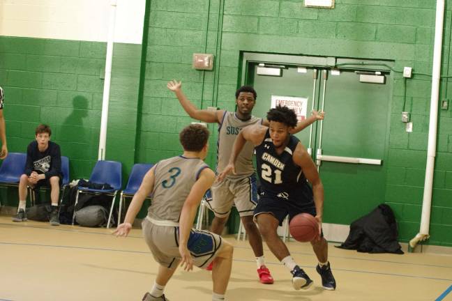 Camden downs Sussex in men's hoops Camden's Abdulazim Bey-Price moves forward with the ball.