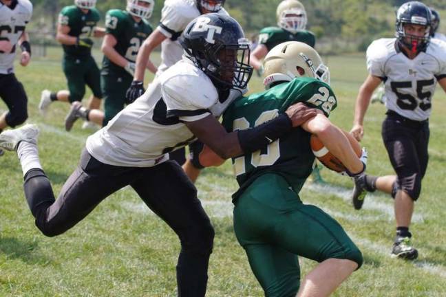 Sussex Tech romps over Bergen A Bergen Tech Knight grabs a Sussex Tech Mustang.