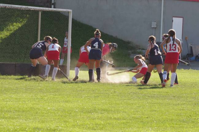 High Point tops LVRHS in field hockey opener The Lenape Valley Patriots and the High Point Wildcats battle for control of the ball in front of the goal post. Photos by George Leroy Hunter