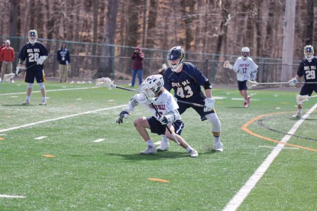 Lenape Valley falls in boys lacrosse Lenape Valley's Drew Togno carries the ball while shadowed by Delaware Valley's Jake Norgard.