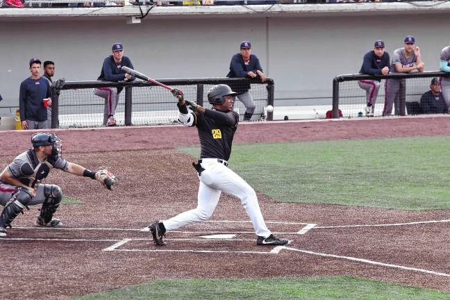 Miners lead division <b>The ball goes into foul territory after being hit by Miners batter Mahki Backstrom in the second inning. He scored one run in the game.</b>