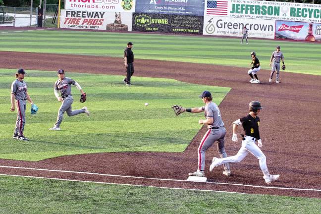 Miners lead division <b>The Sussex County Miners’ Hunter D'Amato reaches first base before the ball in the second inning of a game against the Brockton Rox on Saturday, Aug. 2. The Miners won, 9-3. (Photos by George Leroy Hunter)</b>