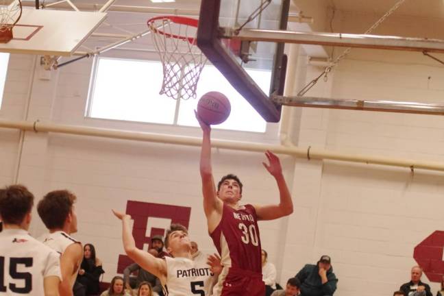 Newton's Maxwell Maslowski aims the ball at the hoop in the third period.